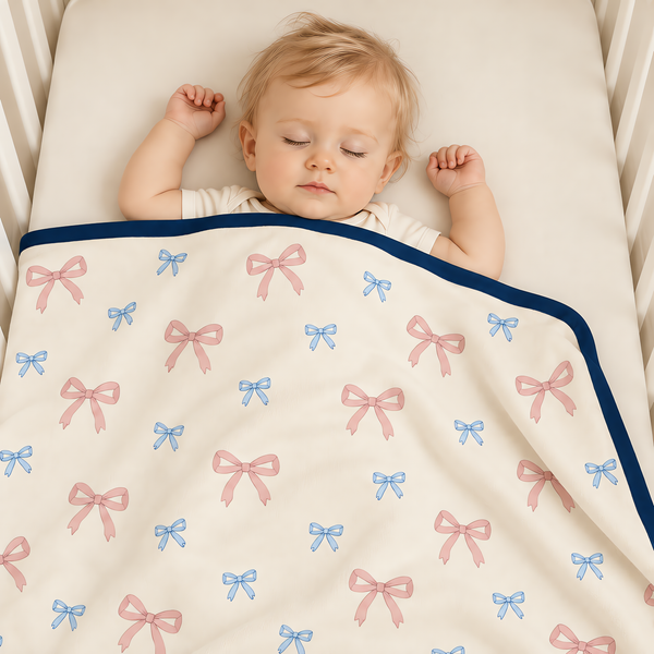 A baby wearing the JOWI Baby Blanket on a plain studio background, full body