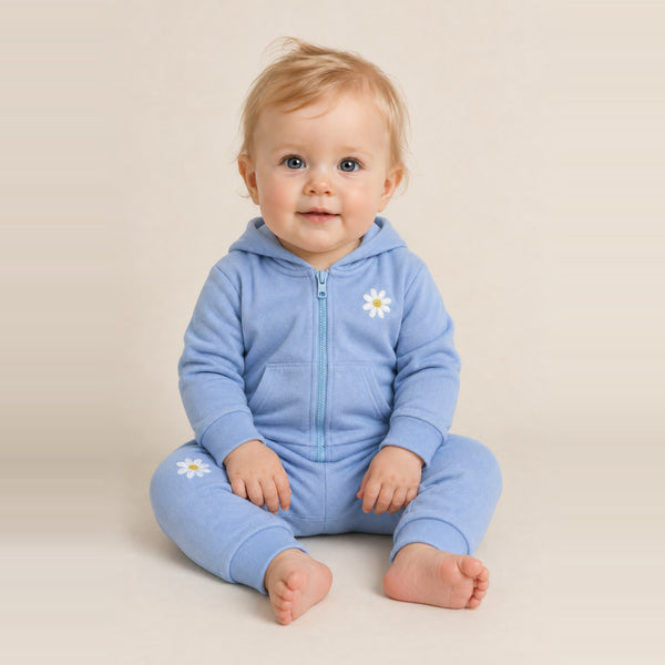 Toddler girl sitting in the JOWI Blue Daisy Hoodie & Jogger Set, size 12-24 months