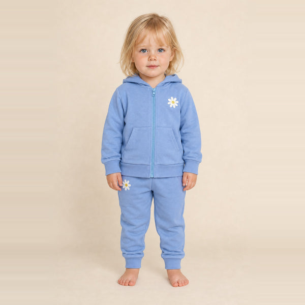 Little girl standing in the JOWI Blue Daisy Hoodie & Jogger Set, size 2T-3T