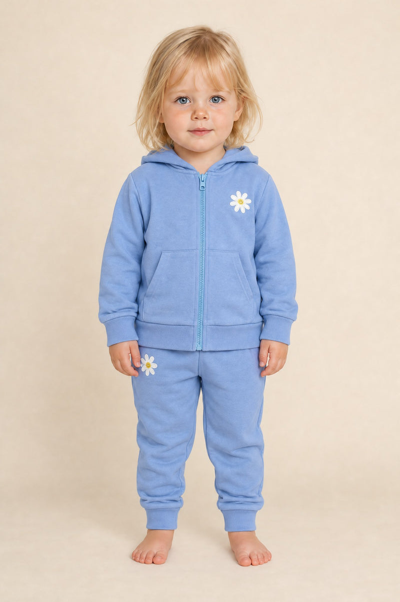Little girl standing in the JOWI Blue Daisy Hoodie & Jogger Set, size 2T-3T