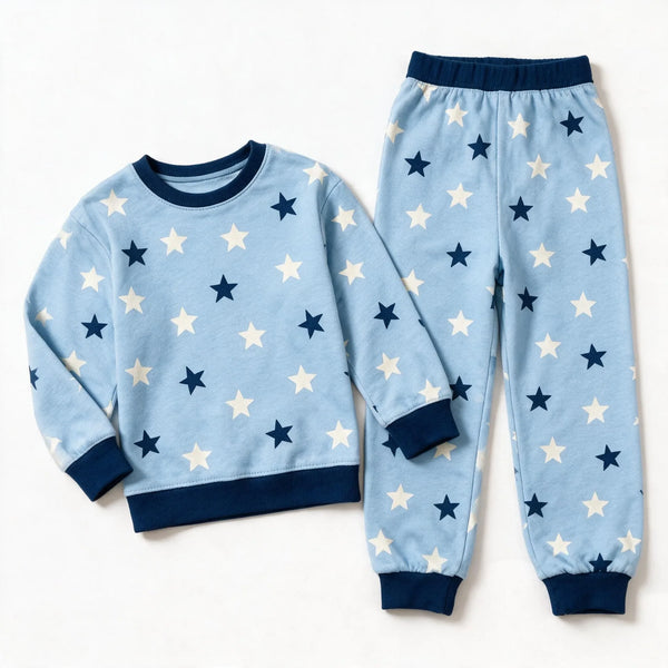 JOWI Blue Star Dream Set shown flat from the front, cream and navy stars on light blue, navy ribbing
