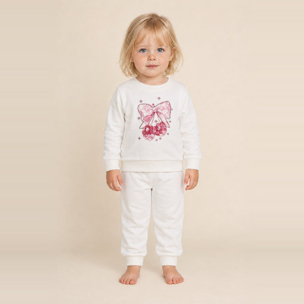 Little girl standing in the JOWI Cherry Bow Sweatshirt & Jogger Set, size 2T-3T