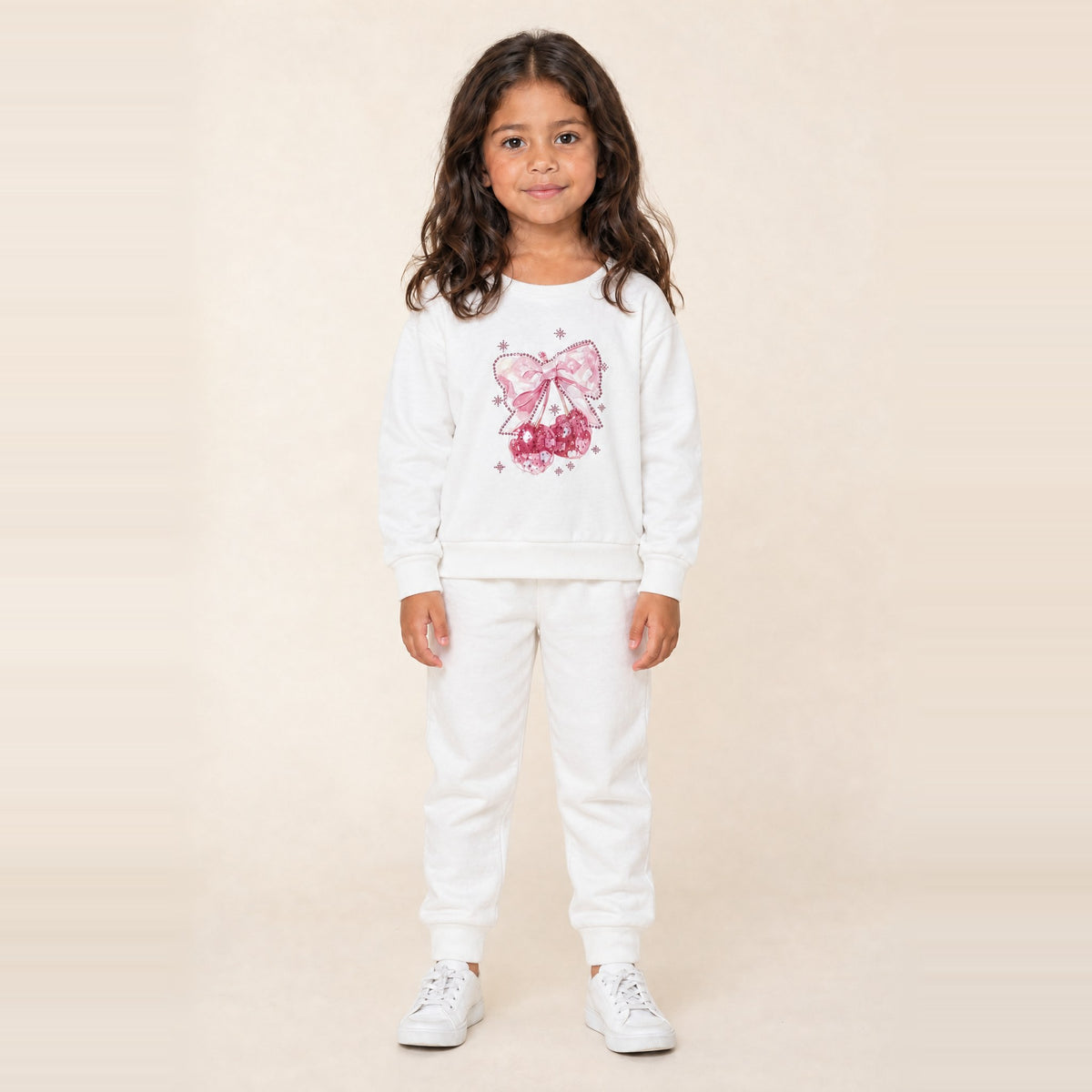 Girl standing in the JOWI Cherry Bow Sweatshirt & Jogger Set, size 4T-6T