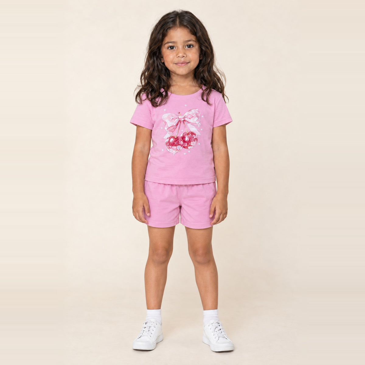 Girl standing in the JOWI Cherry Bow Tee & Short Set, size 4T-6T