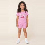 Girl standing in the JOWI Cherry Bow Tee & Short Set, size 4T-6T