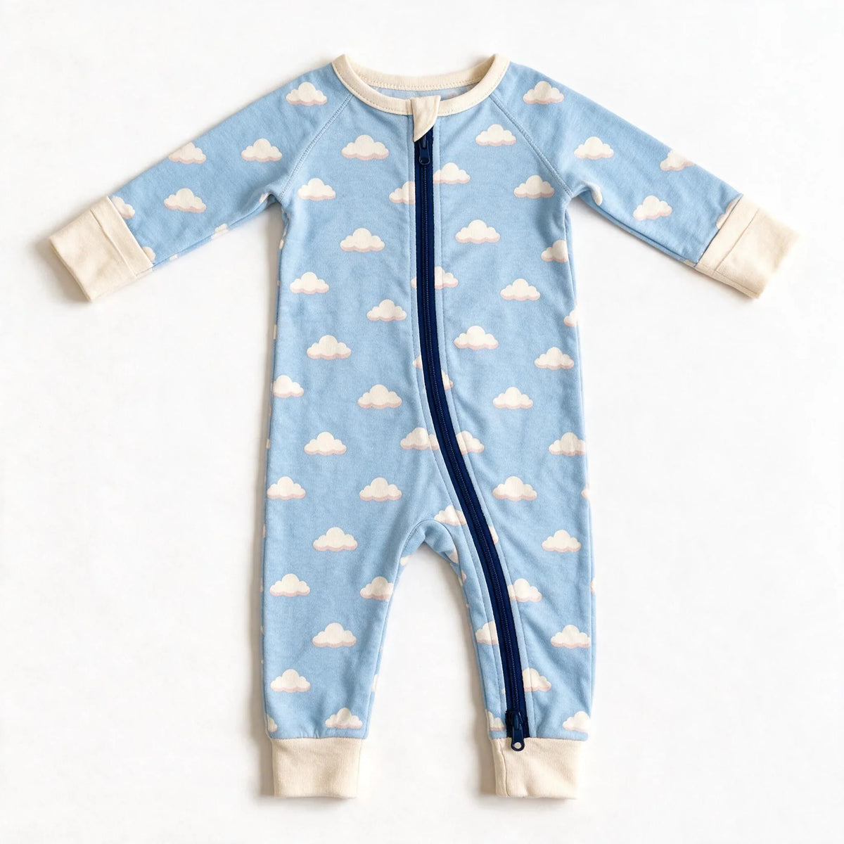JOWI Cozy Cloud Sleepsuit shown flat from the front, cream clouds on light blue, cream trims, navy zip