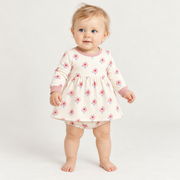 A baby wearing the JOWI Little Rose Dress Set on a plain studio background, full body