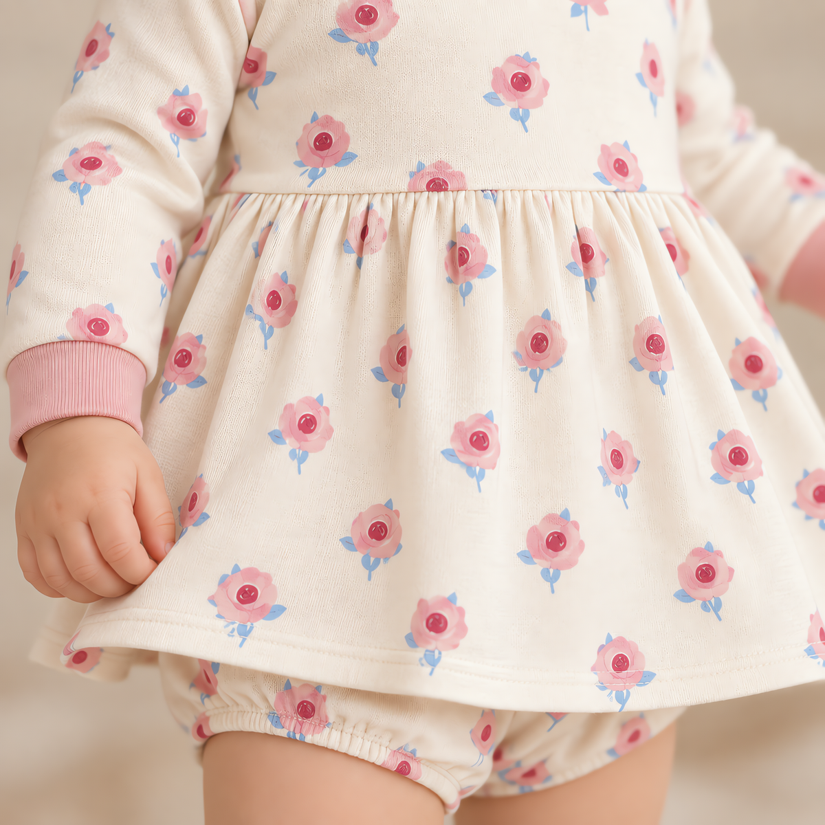 Close up of the JOWI Little Rose Dress Set worn, with the printed cloth at true scale