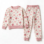 JOWI Pink Floral Pajama Set shown flat from the front, dense soft pink floral on cream, dusty pink ribbing