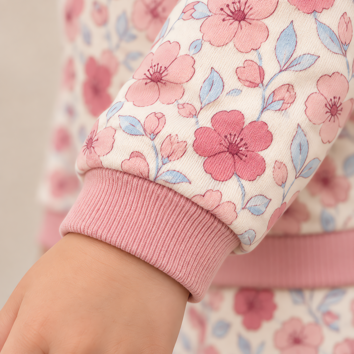 Close up of the JOWI Pink Floral Pajama Set worn, with the printed cloth at true scale