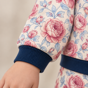 Close up of the JOWI Rose Garden Pajama Set worn, with the printed cloth at true scale